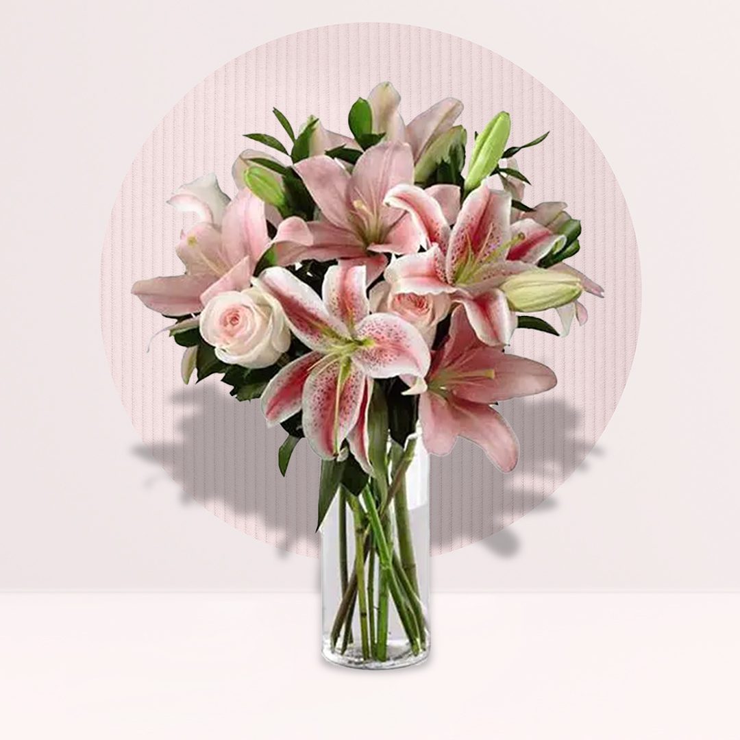 A floral bouquet of pink roses accented with wispy baby's breath.