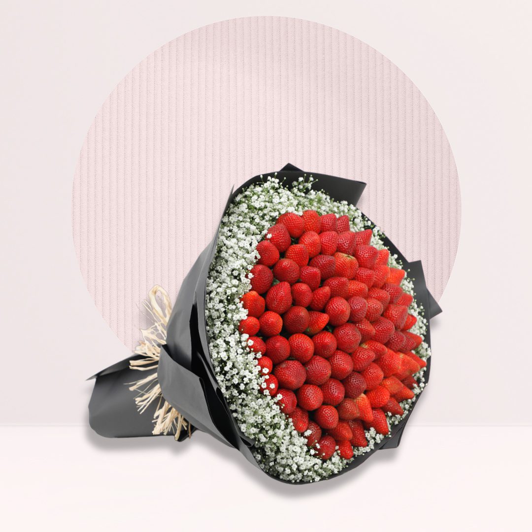 Cherry hand bouquet Fresh strawberry bouquet with baby’s breath in elegant black wrapping.