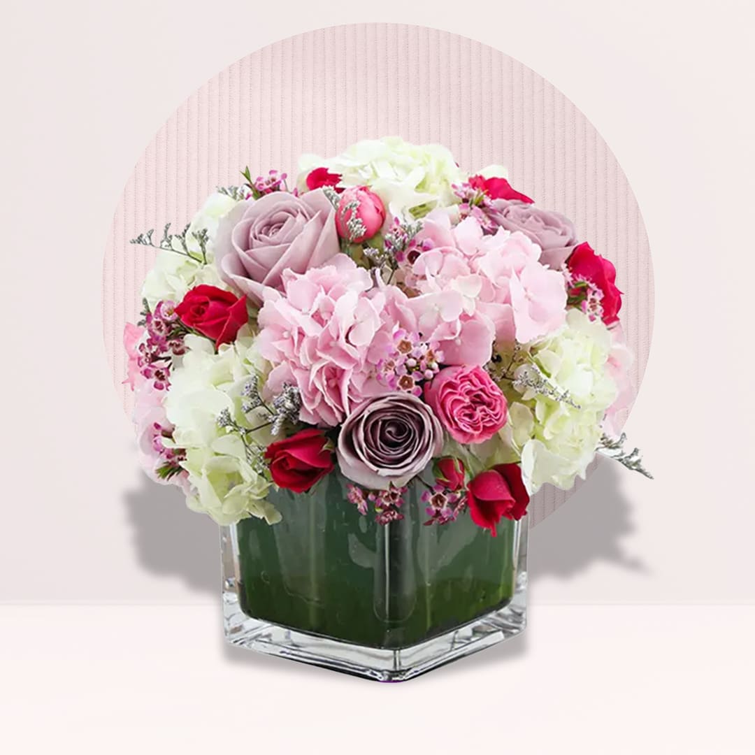18 (5) Blush pink hydrangea and violet rose vase arrangement with red roses and white blooms