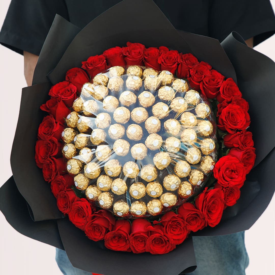 Rose Bouquet Large red rose bouquet with Ferrero Rocher chocolates in elegant black wrapping.