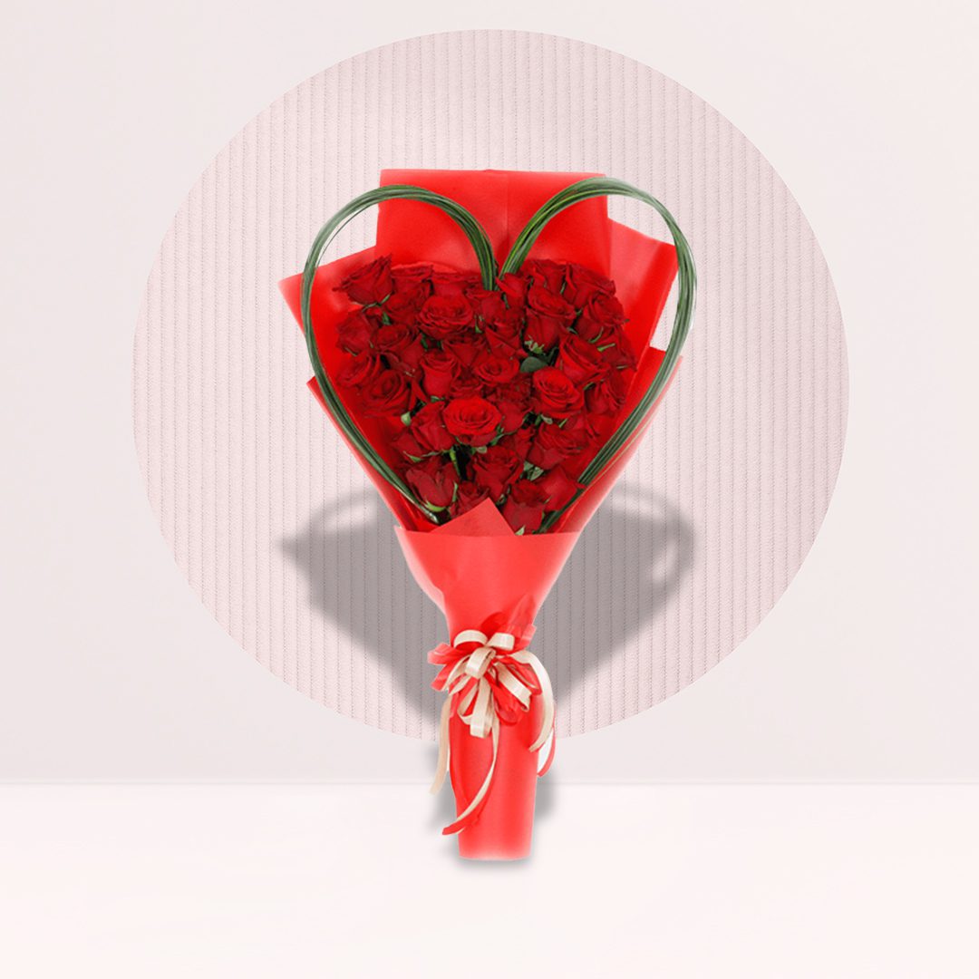 6 (8) Red rose and red spray rose bouquet with heart-shaped greenery and red wrapping