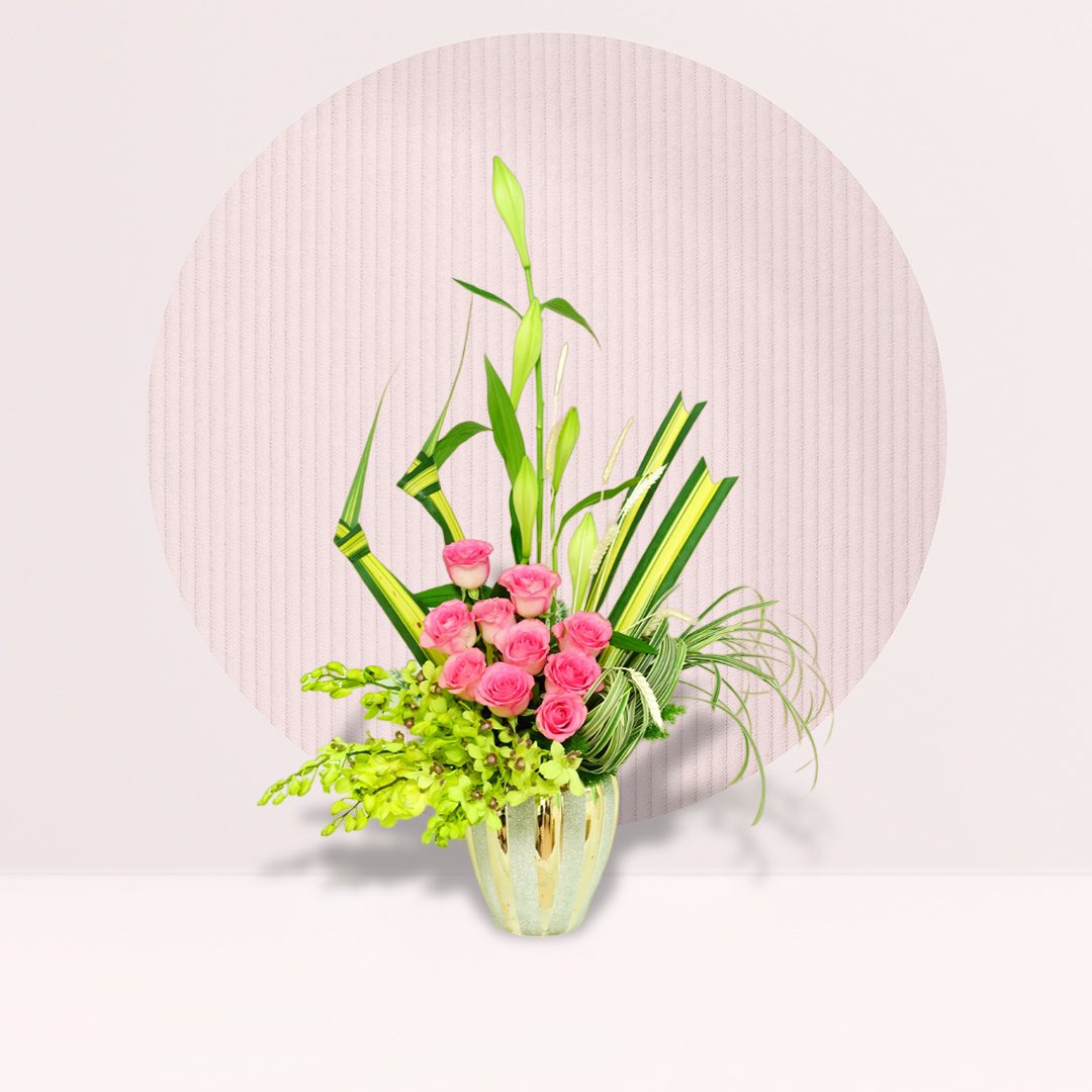 Ikebana pink roses arrangement with orchids, Mad Lily and seasonal greenery in a decorative vase