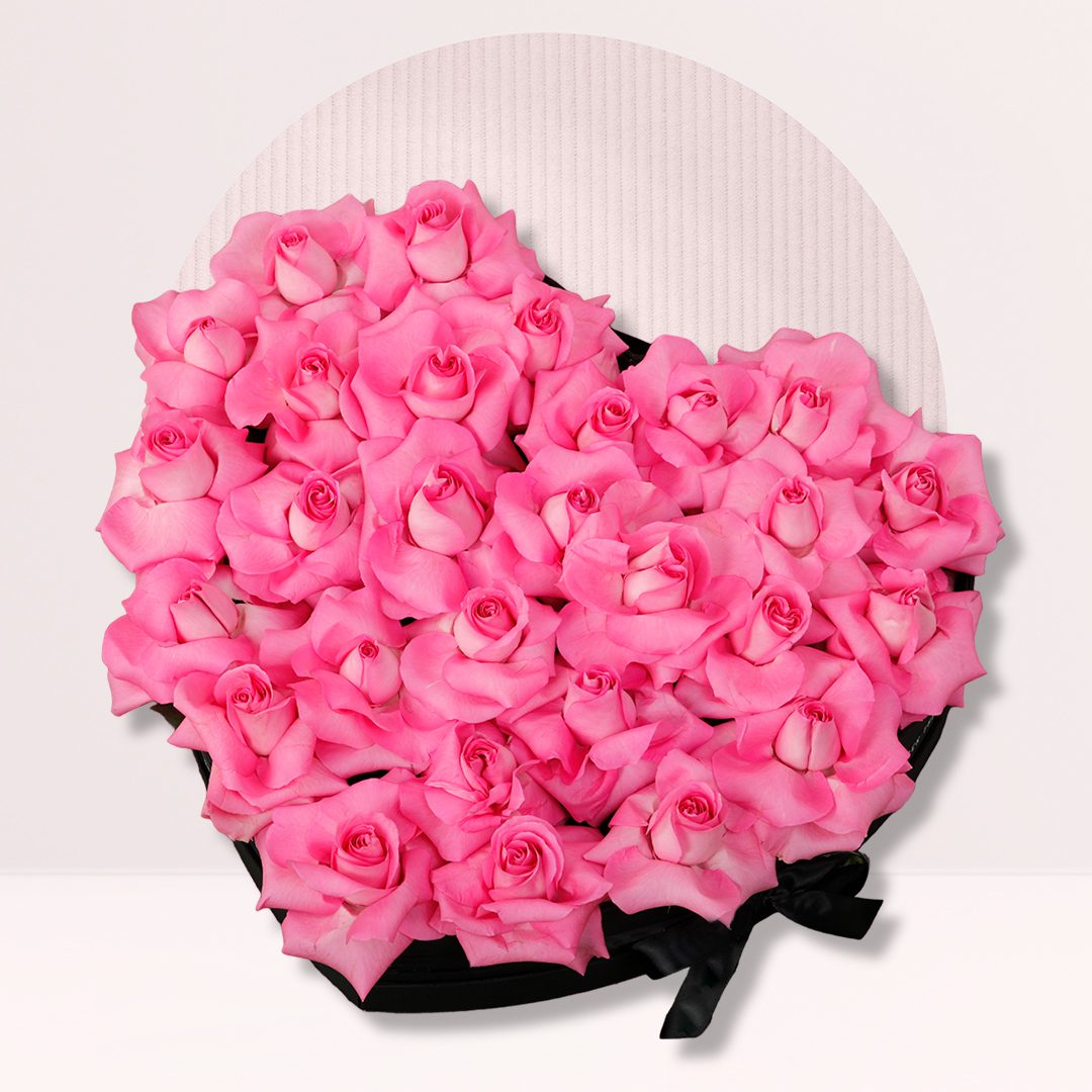 Heart Shap Rose Box Pink roses arranged in an elegant heart-shaped flower box