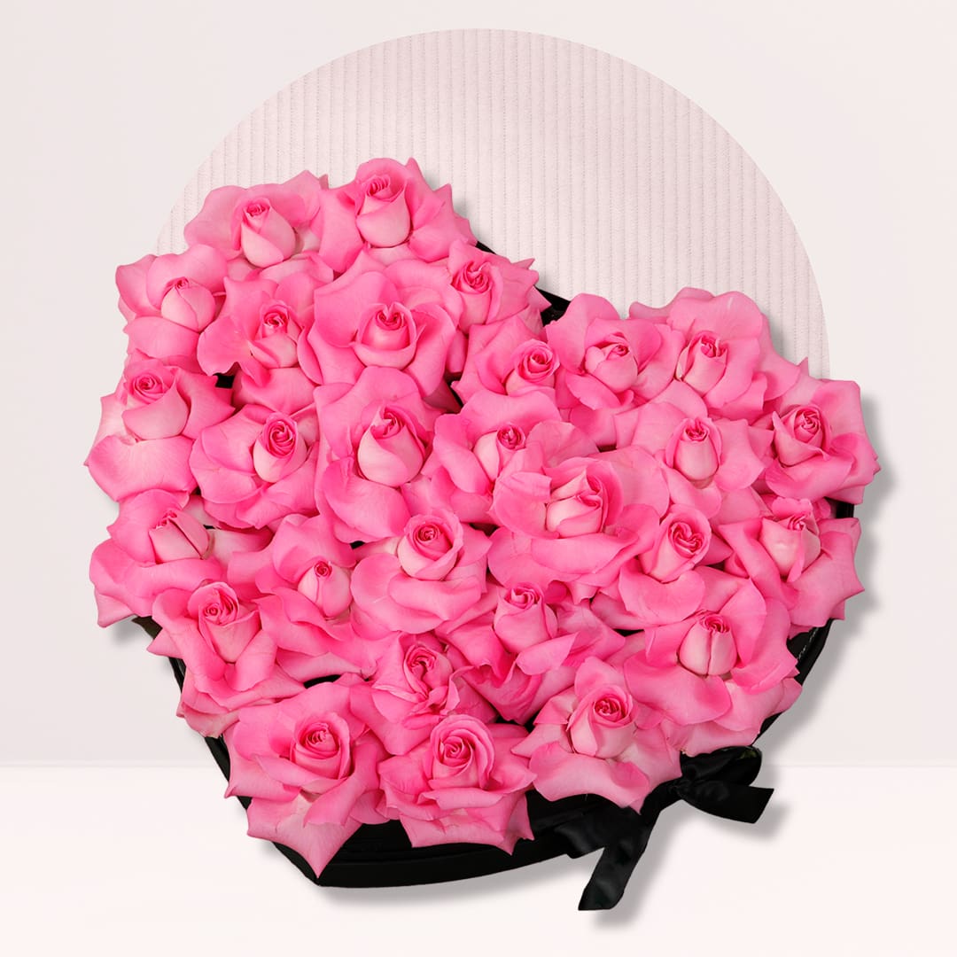 Heart Shap Rose Box Pink roses arranged in an elegant heart-shaped flower box
