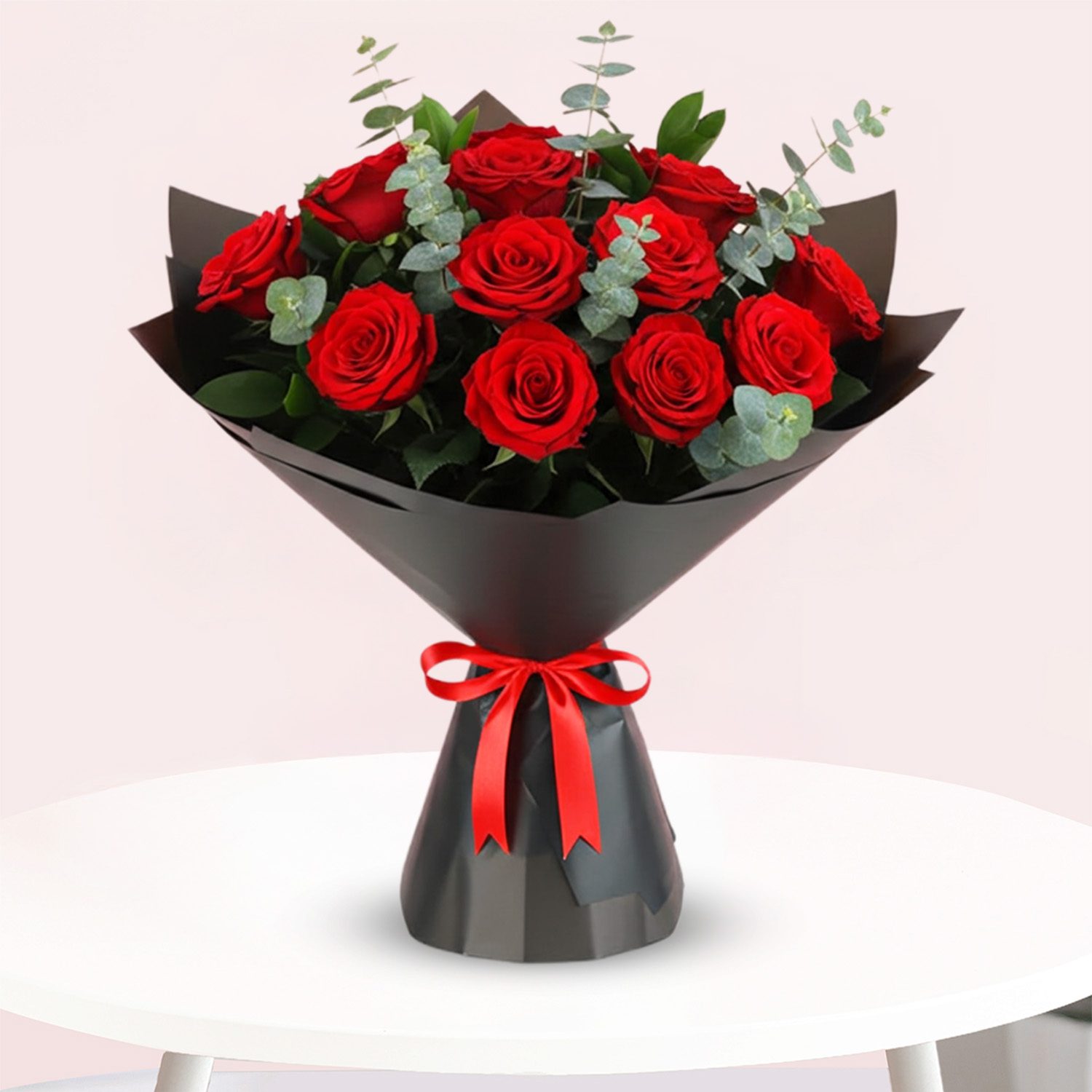 Delightful Red-01 A bouquet of vibrant red roses tied with a matching red ribbon, elegantly arranged for a special occasion.