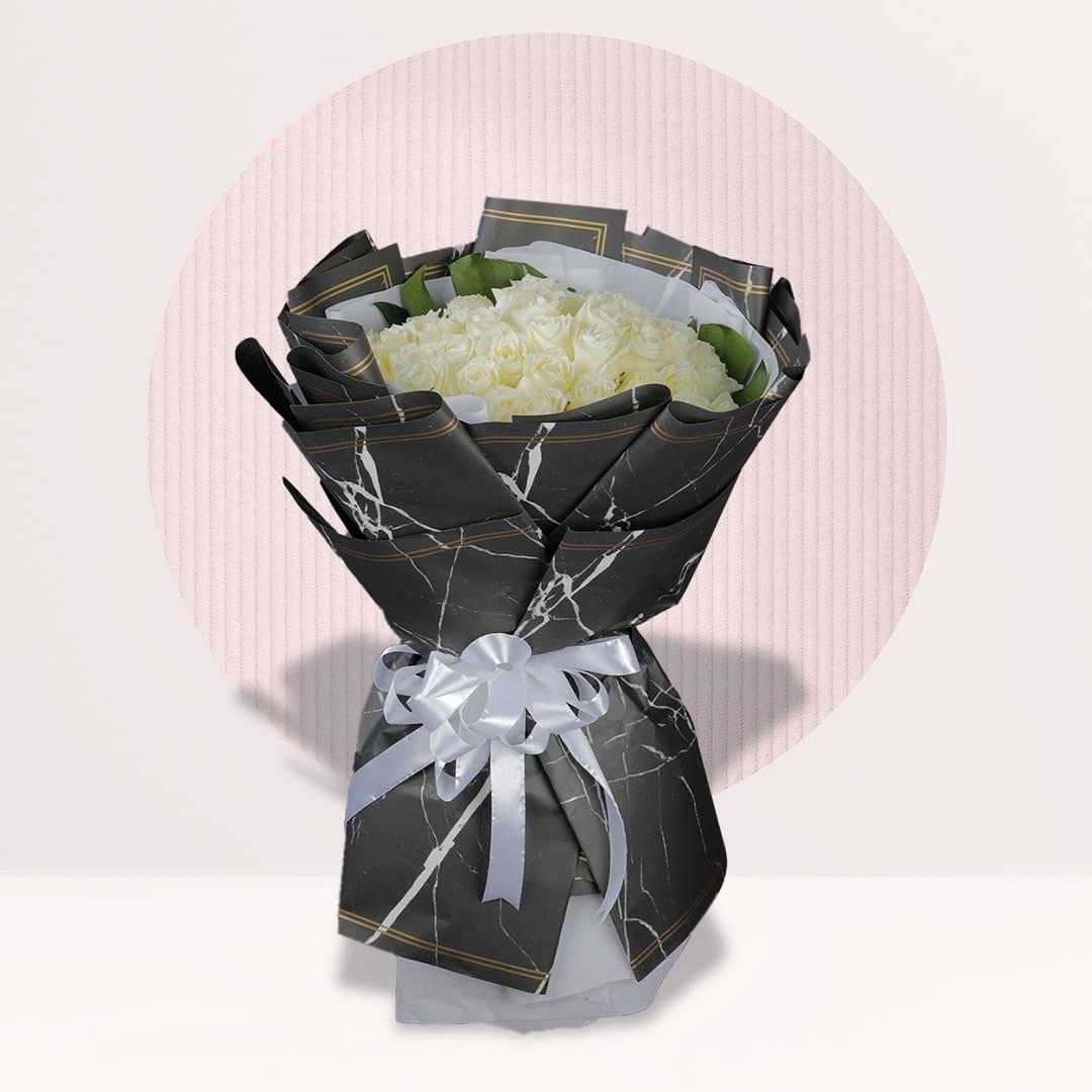 Rose Bouquet White rose bouquet in black marble wrap with white ribbon