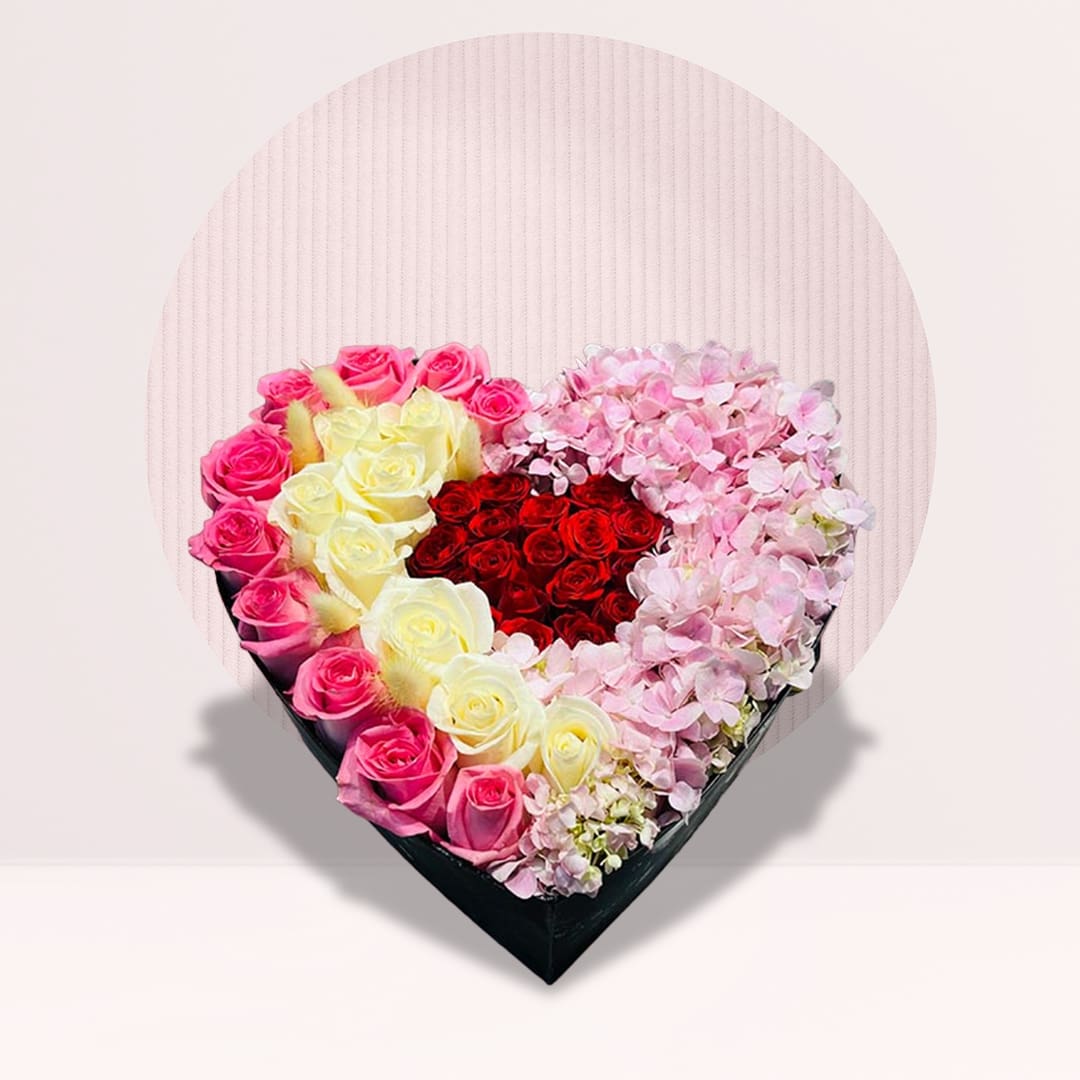 1 (75) Pink and ivory rose heart box with red spray roses and pink hydrangeas