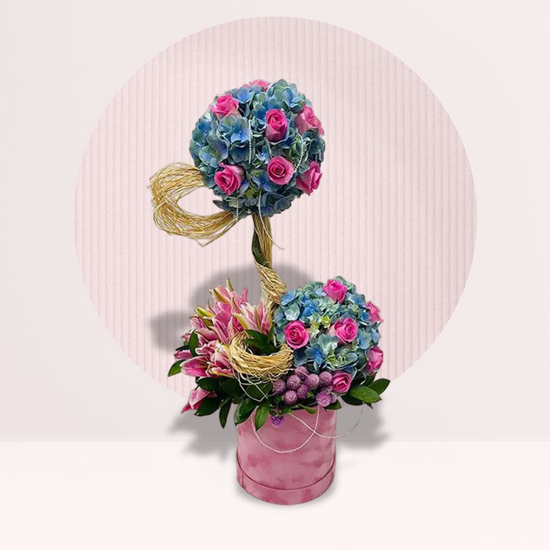 23 Blue hydrangeas with pink roses and lilies in sculptural flower box arrangement