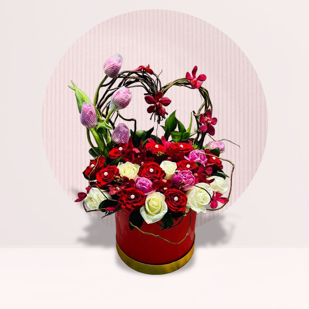 3 (27) Red and white roses with pink tulips in heart-shaped flower box