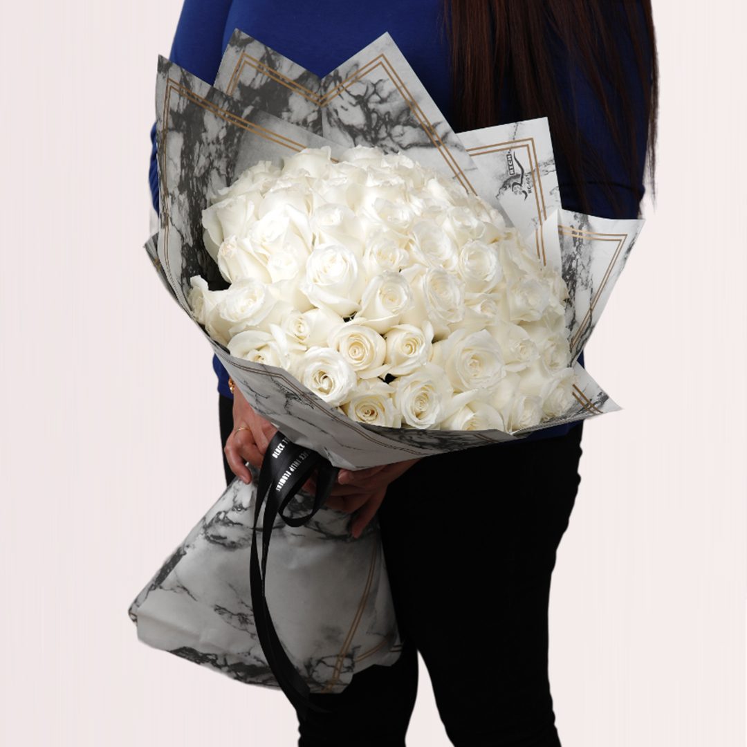9 Pearl white rose grandeur bouquet in elegant marble-style wrapping