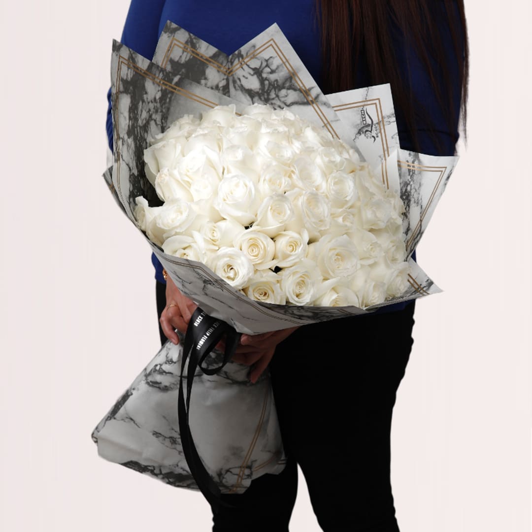 9 Pearl white rose grandeur bouquet in elegant marble-style wrapping
