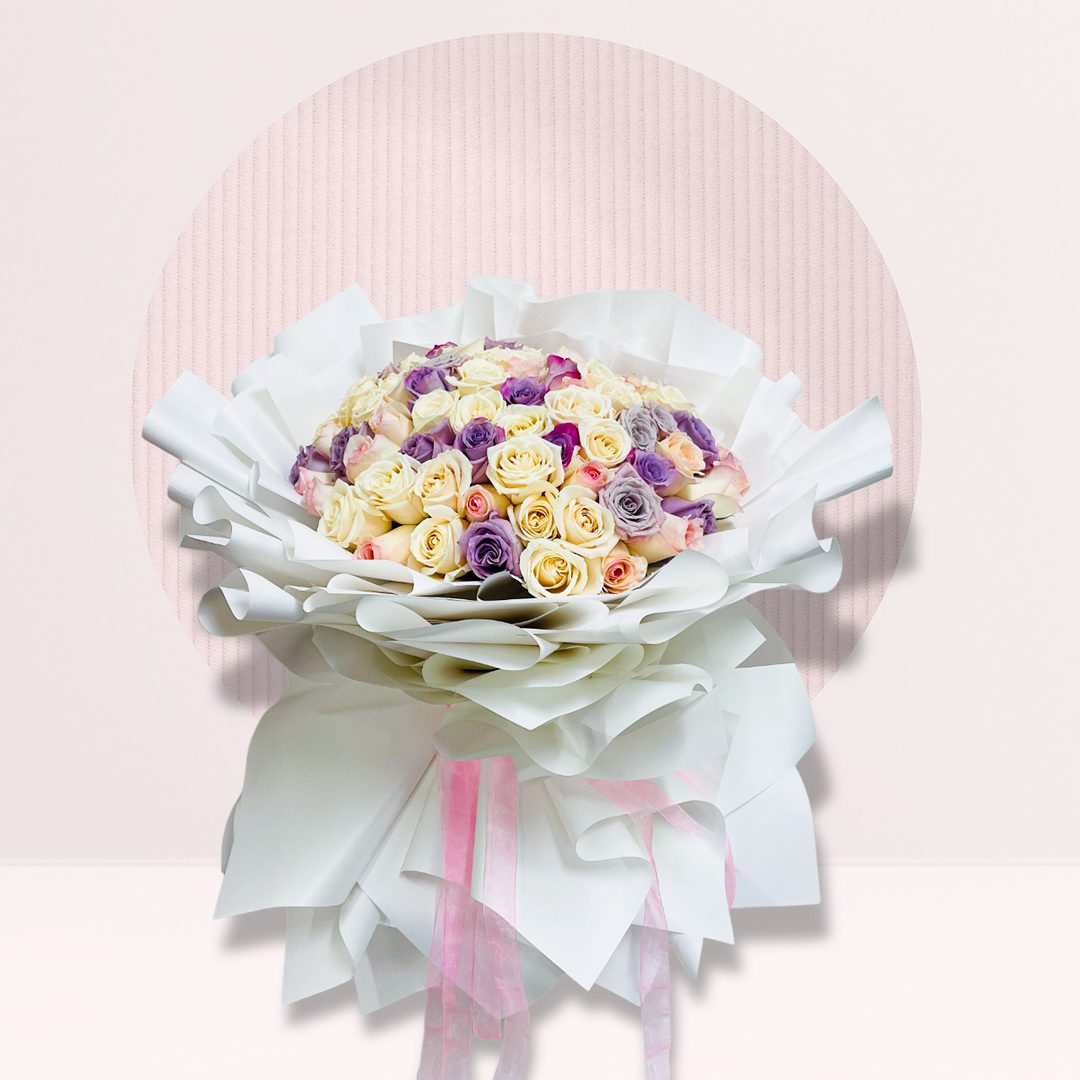 IMG_0986 99 mixed rose bouquet with cream peach purple and lilac roses in white wrapping