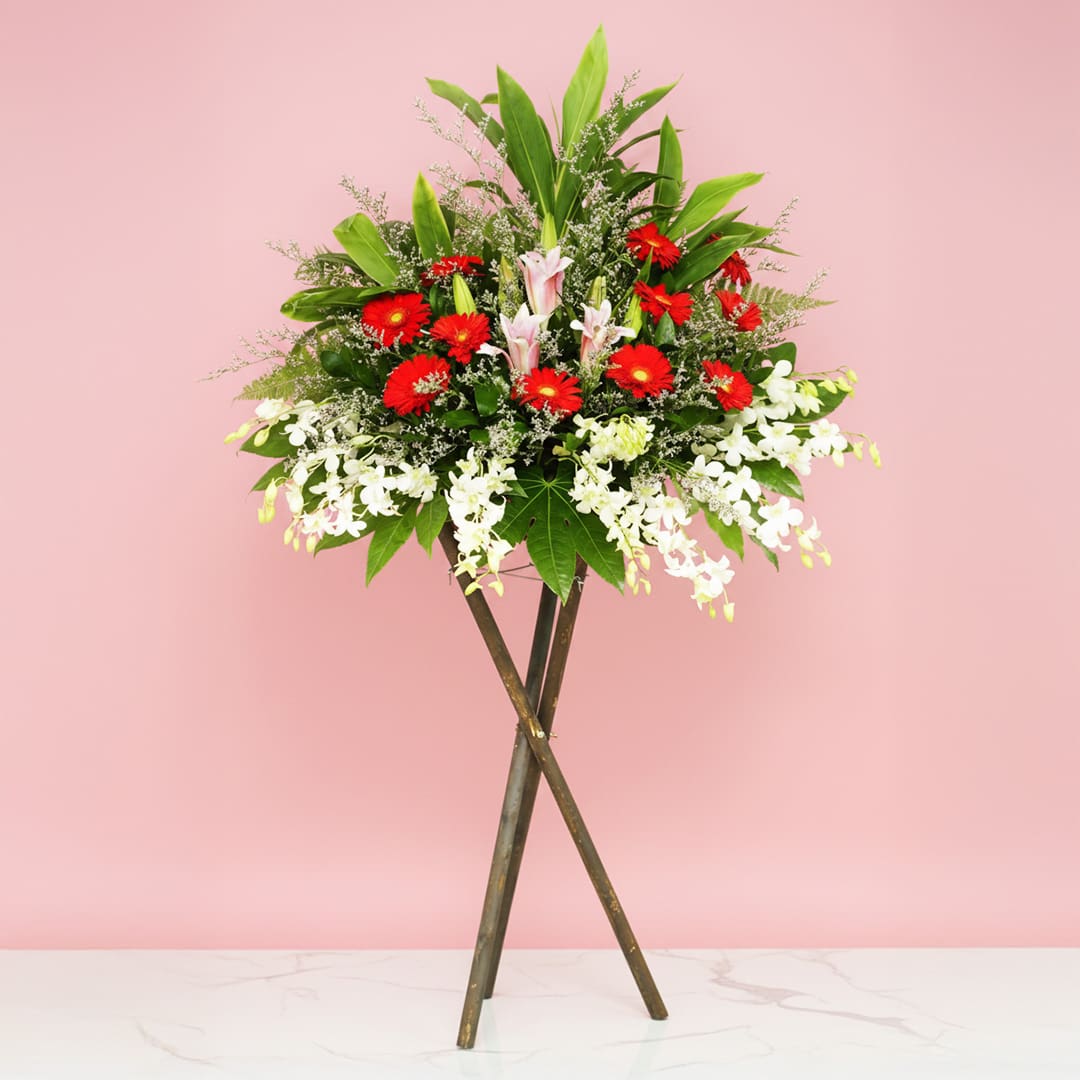 aspiration_25 Colourful mixed flower grand opening stand with seasonal greenery