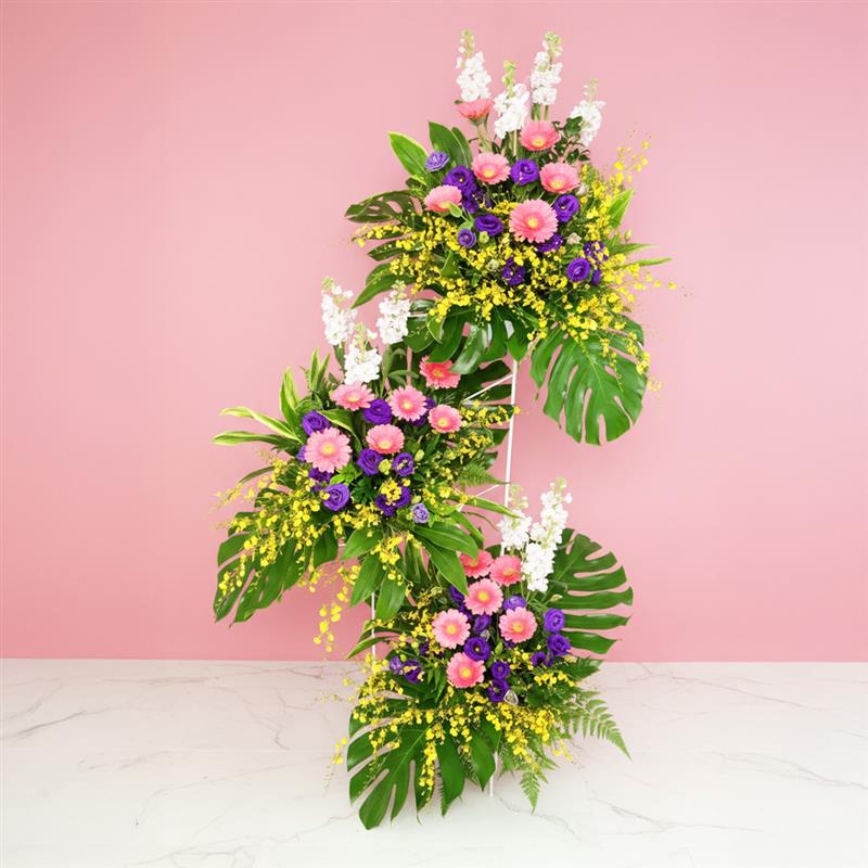 blessings-25-01 A Large opening flower stand with Gerbera, eustoma, Matthiola and Golden Shower.