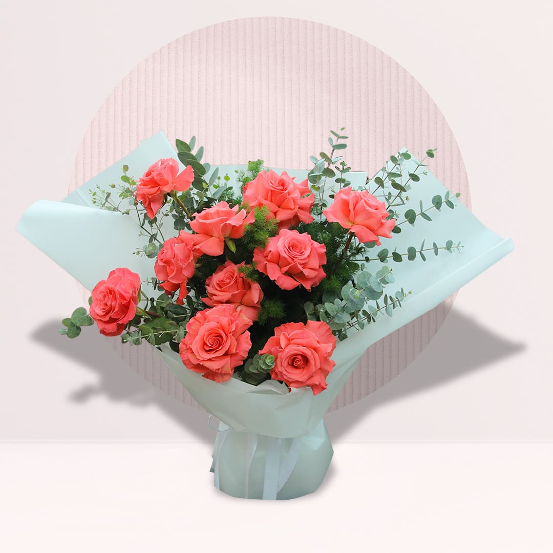 1 Coral Sunset Rose Bouquet featuring fresh roses, eucalyptus, and asparagus foliage arranged in an elegant and modern floral design.