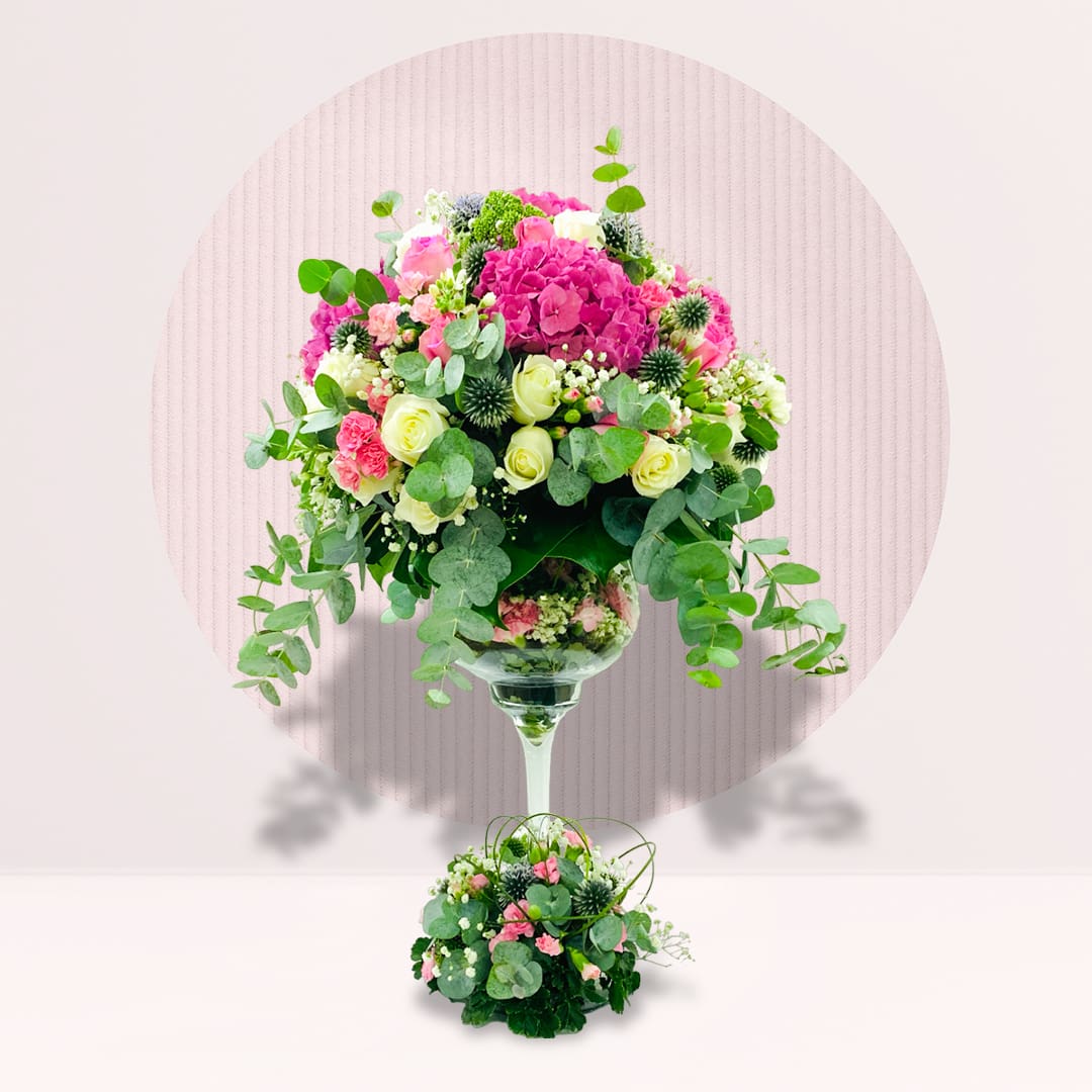 7 Tall floral tower arrangement with mixed flowers and greenery.