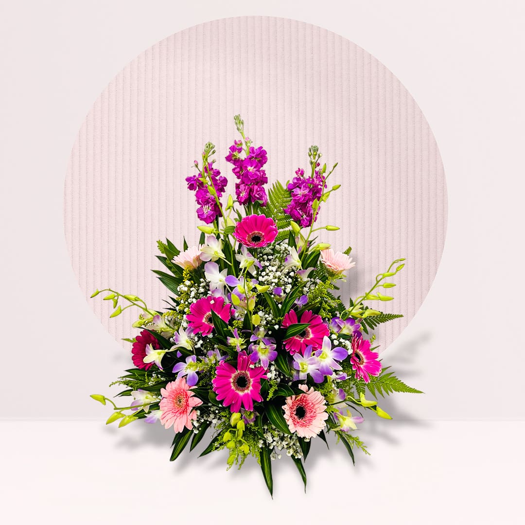 IMG_2172 Colourful mixed flower table centrepiece with fresh greenery.
