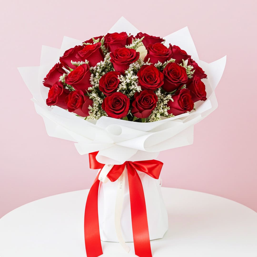 Red Rose Splendor-13-10 A bouquet of vibrant red roses tied with a matching red ribbon, elegantly arranged for a special occasion.