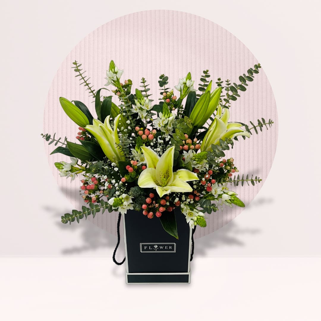 22 White lily flower box with pink berries eucalyptus and greenery