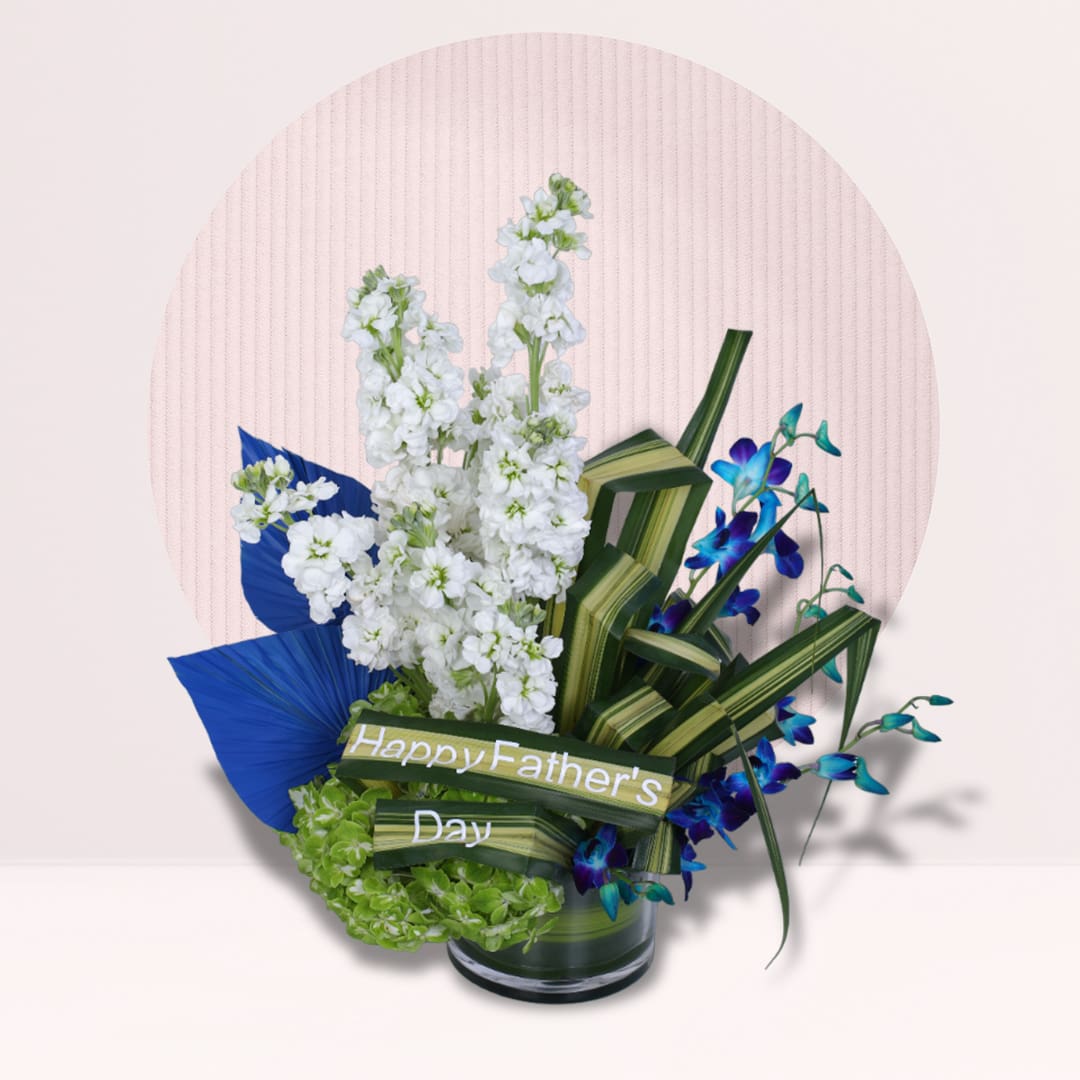 1 Blue orchid Father’s Day vase with white flowers, green hydrangea and decorative foliage.