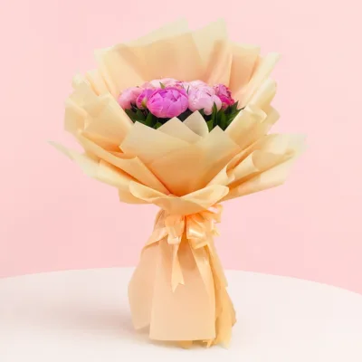 A vibrant display of peonies in full bloom, showcasing their timeless elegance and beauty in a garden setting.