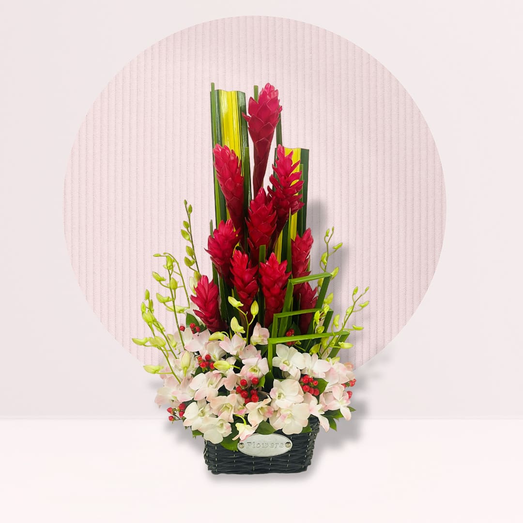 20 Basket arrangement with red ginger, dendrobium orchids, white hydrangeas, red berries and tropical greenery.