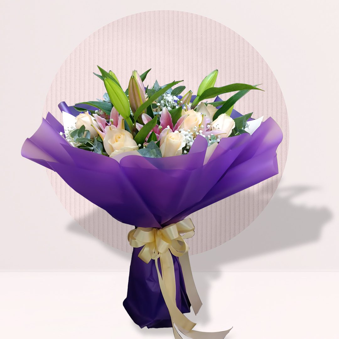 2 White rose and lily bouquet in purple wrapping
