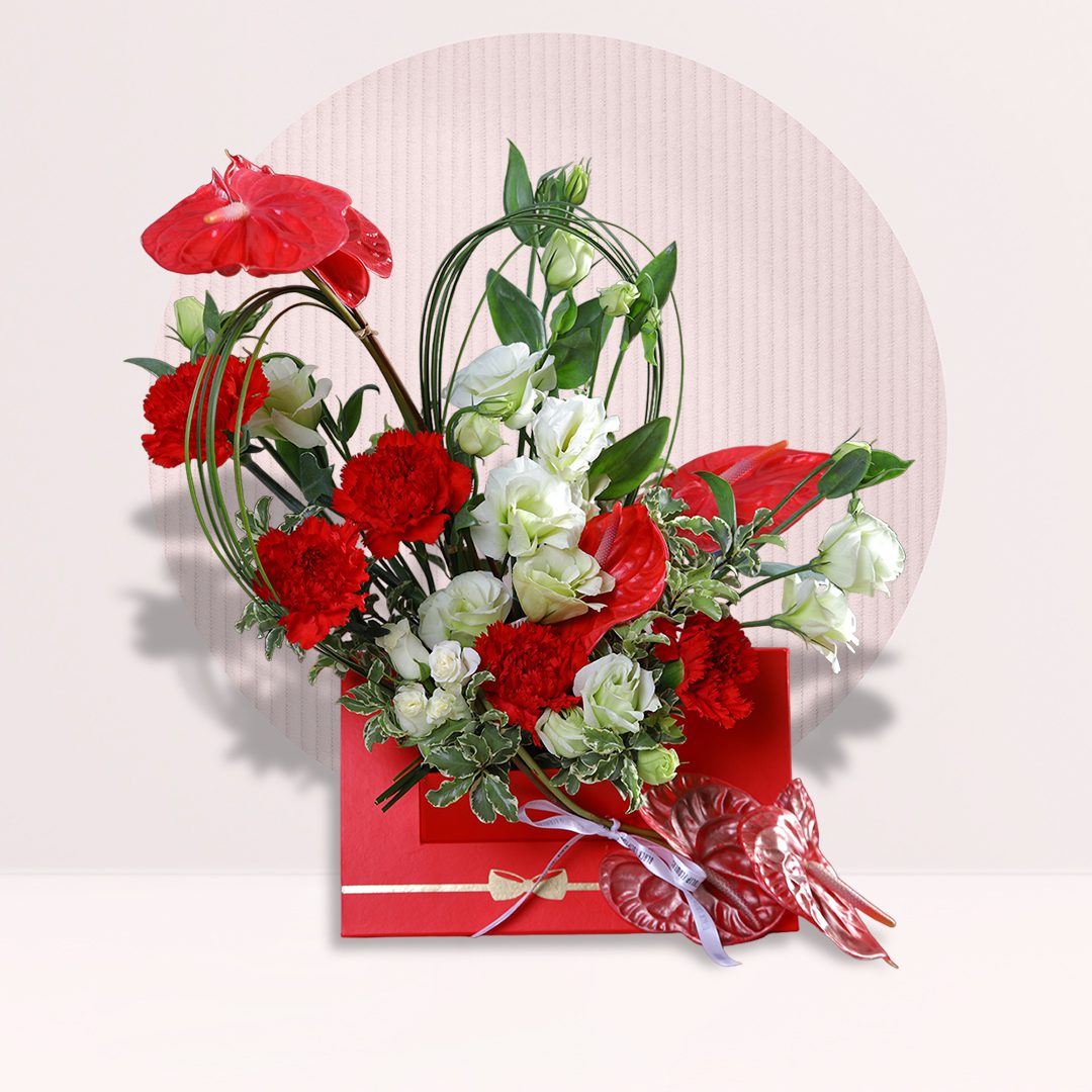 1 Red and white anthurium love arrangement with carnations and fresh greenery