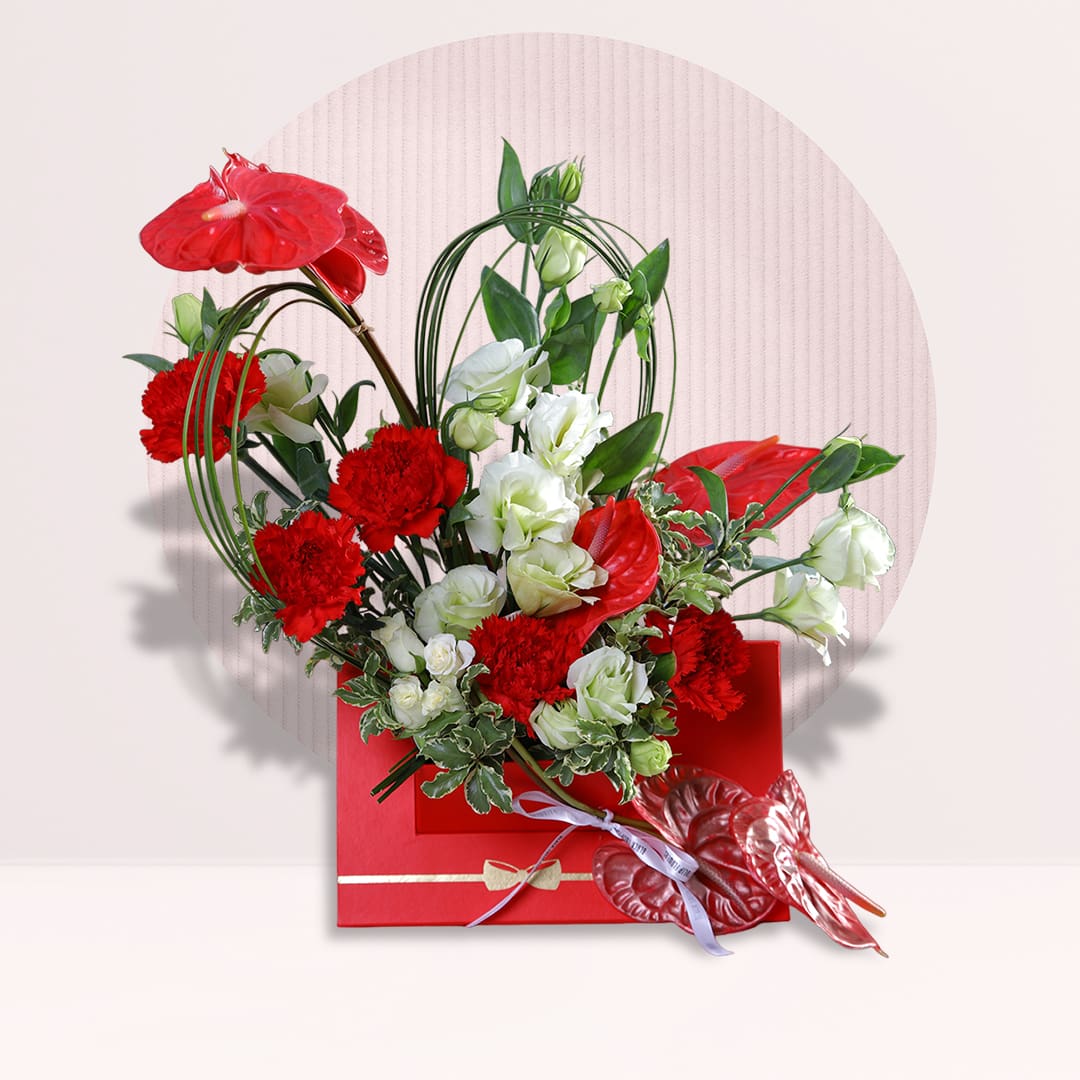 1 Red and white anthurium love arrangement with carnations and fresh greenery