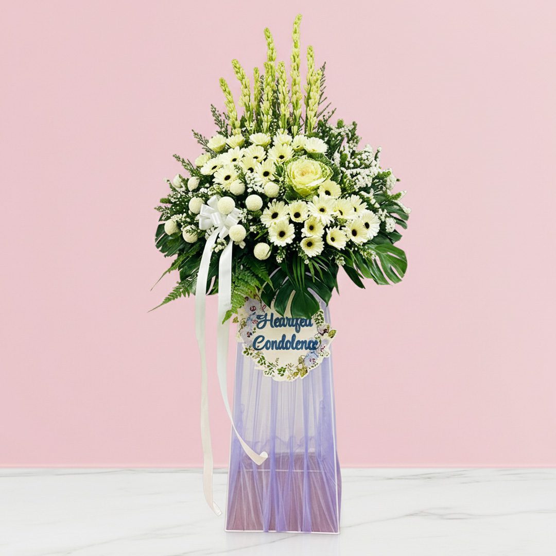 Quiet Reflections Sympathy Display-01-11-21 A heartfelt condolence stand featuring a bouquet of white flowers