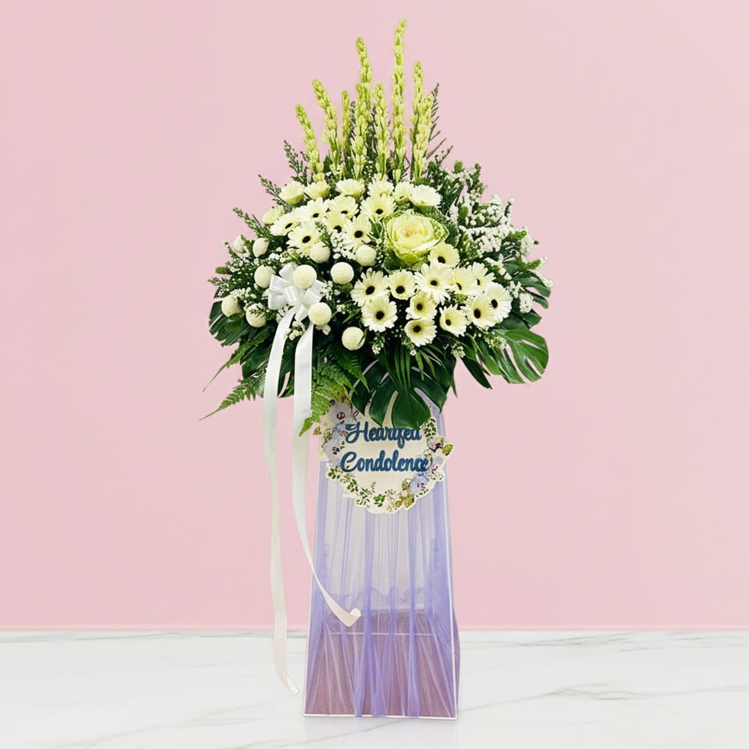 Quiet Reflections Sympathy Display-01-11-21 A heartfelt condolence stand featuring a bouquet of white flowers