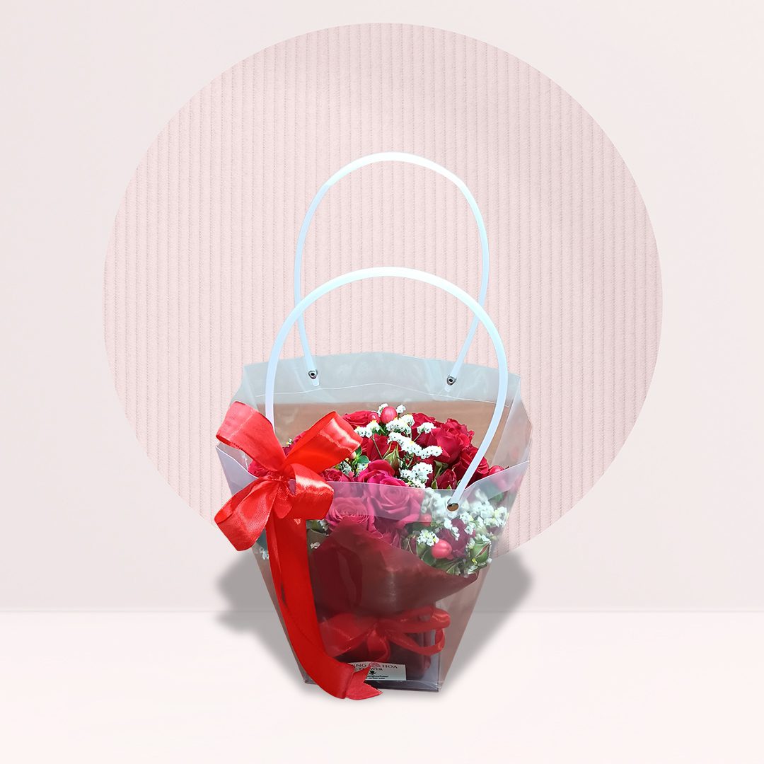 1 Red roses with white baby’s breath in transparent flower gift bag with red bow