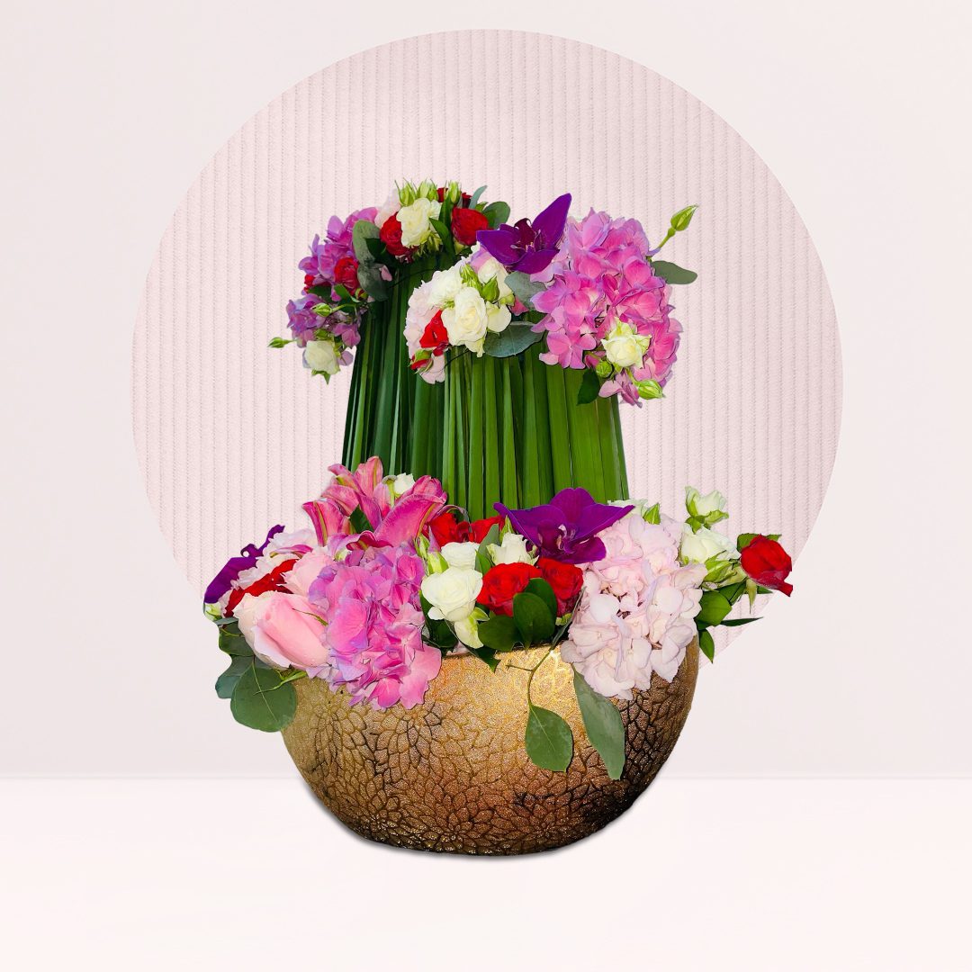 1 (34) Large vase arrangement with fresh mixed flowers and greenery.