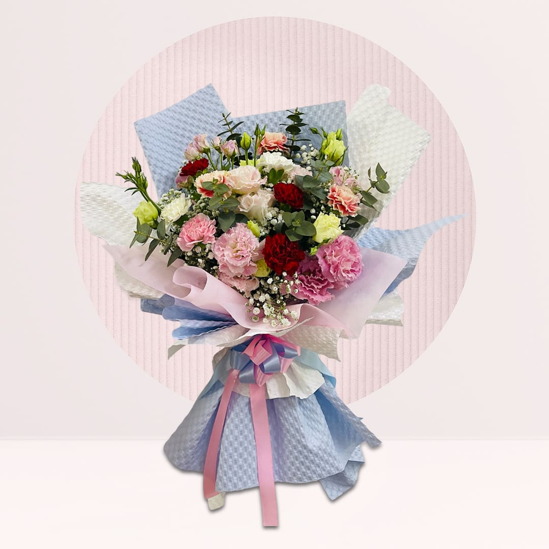 1 (135) Carnation and eustoma bouquet with seasonal greenery in pastel wrapping