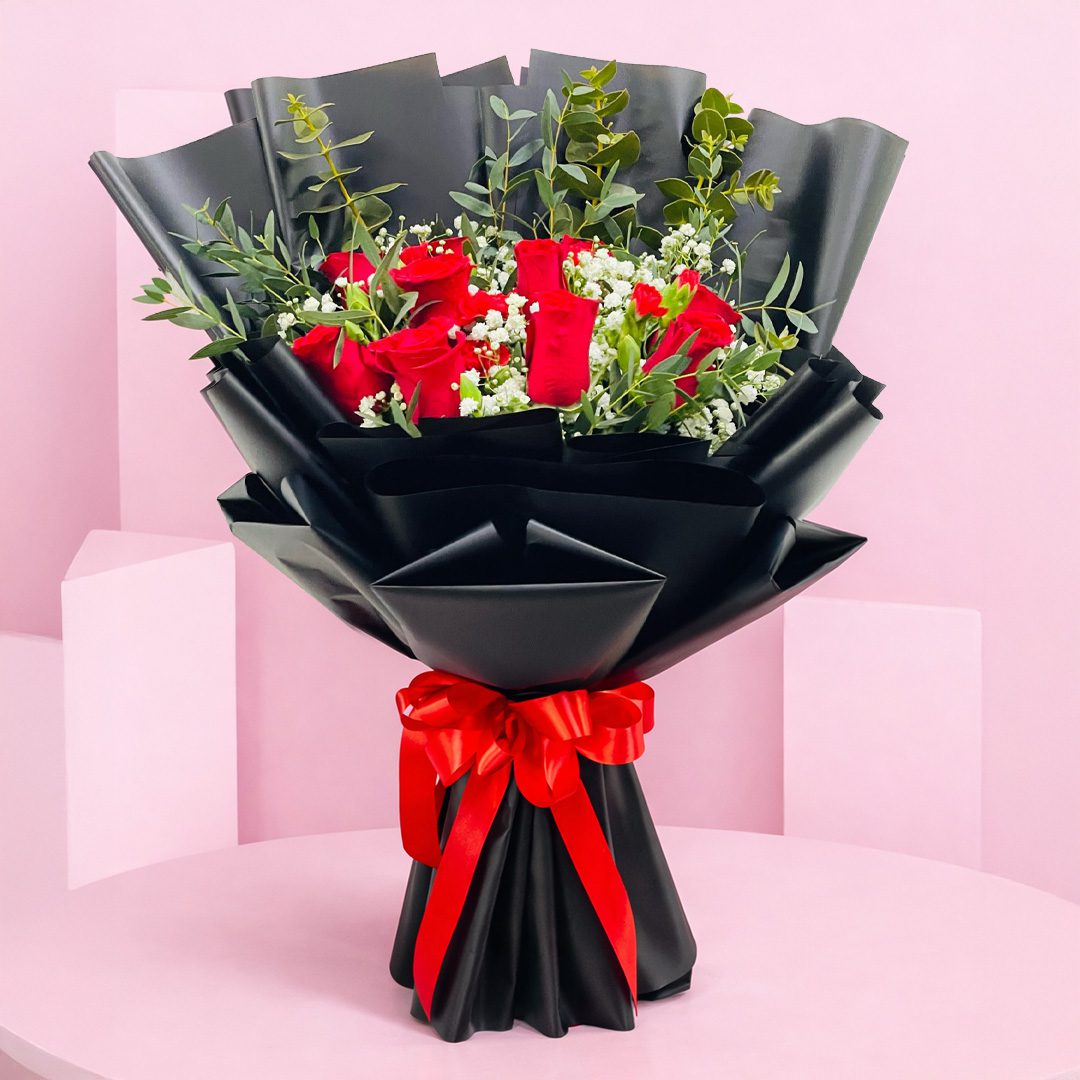 radiant-ruby-bouquet-2026 A beautiful bouquet of red roses alongside elegant white blooms.