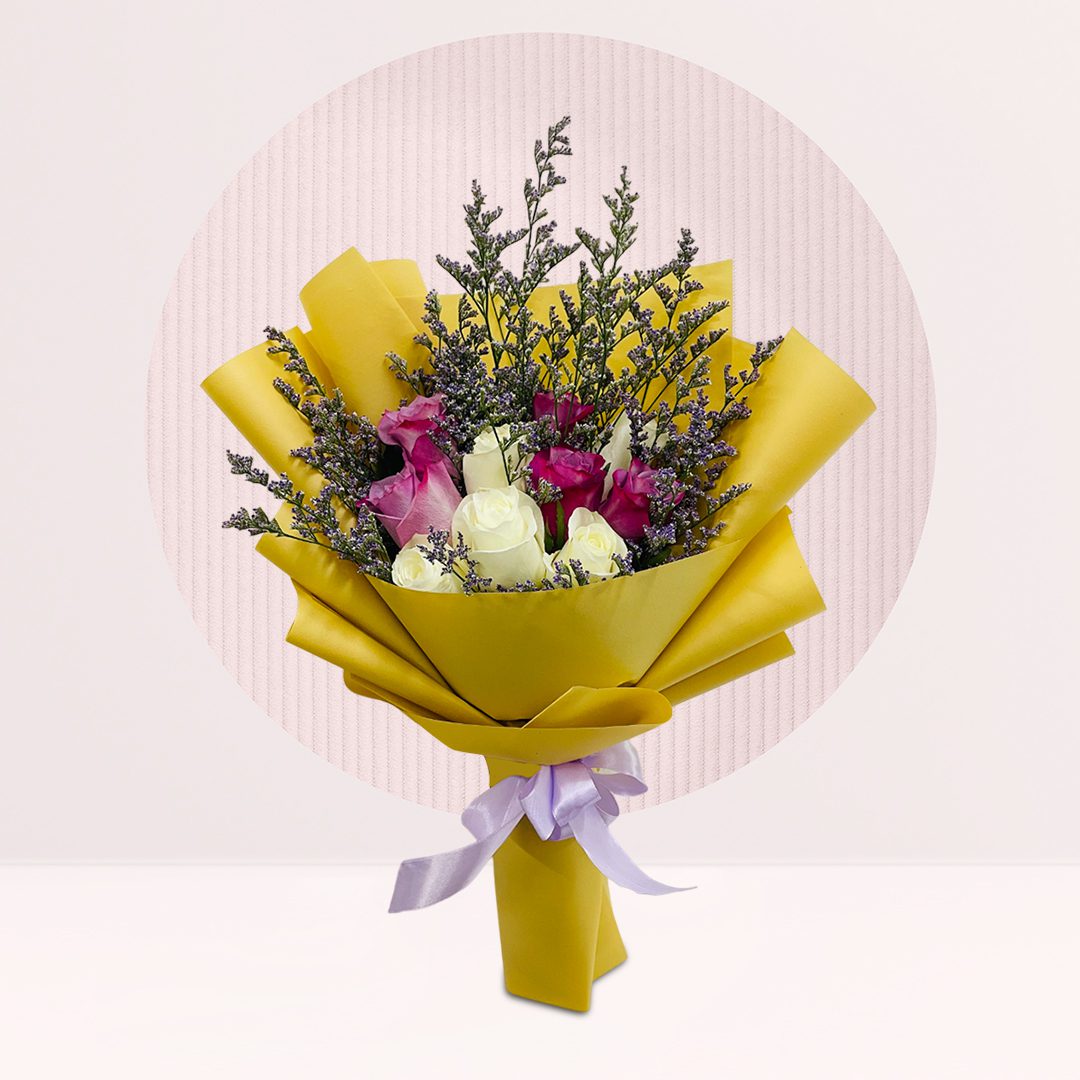 1 (214) Purple and white rose bouquet with purple fillers, greenery and bright yellow wrapping