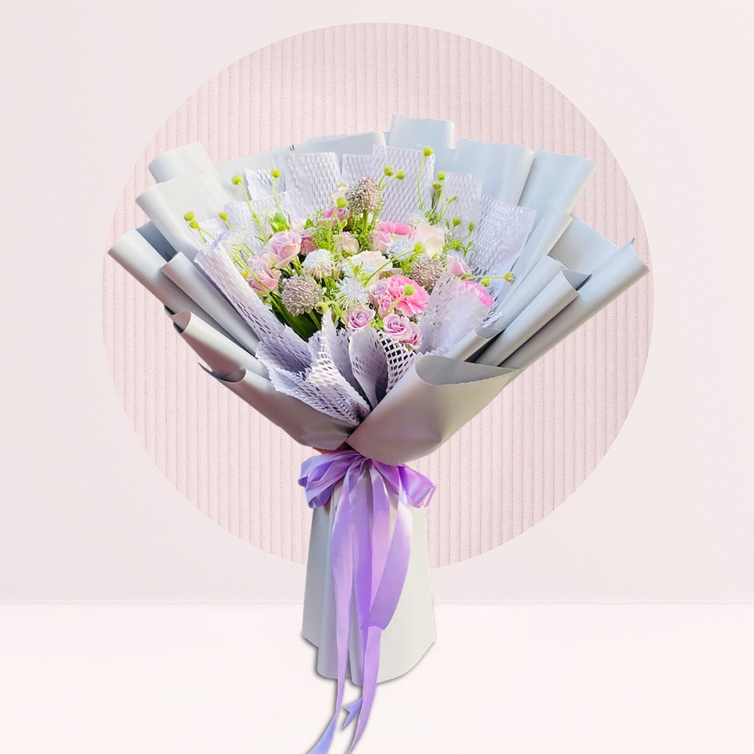 1 (226) : Spray rose and carnation bouquet with seasonal greenery in soft pastel wrapping