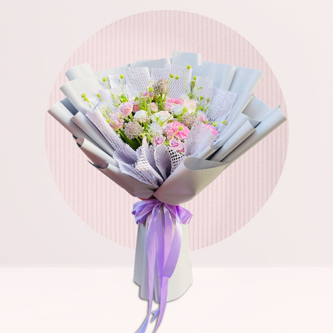 1 (226) : Spray rose and carnation bouquet with seasonal greenery in soft pastel wrapping