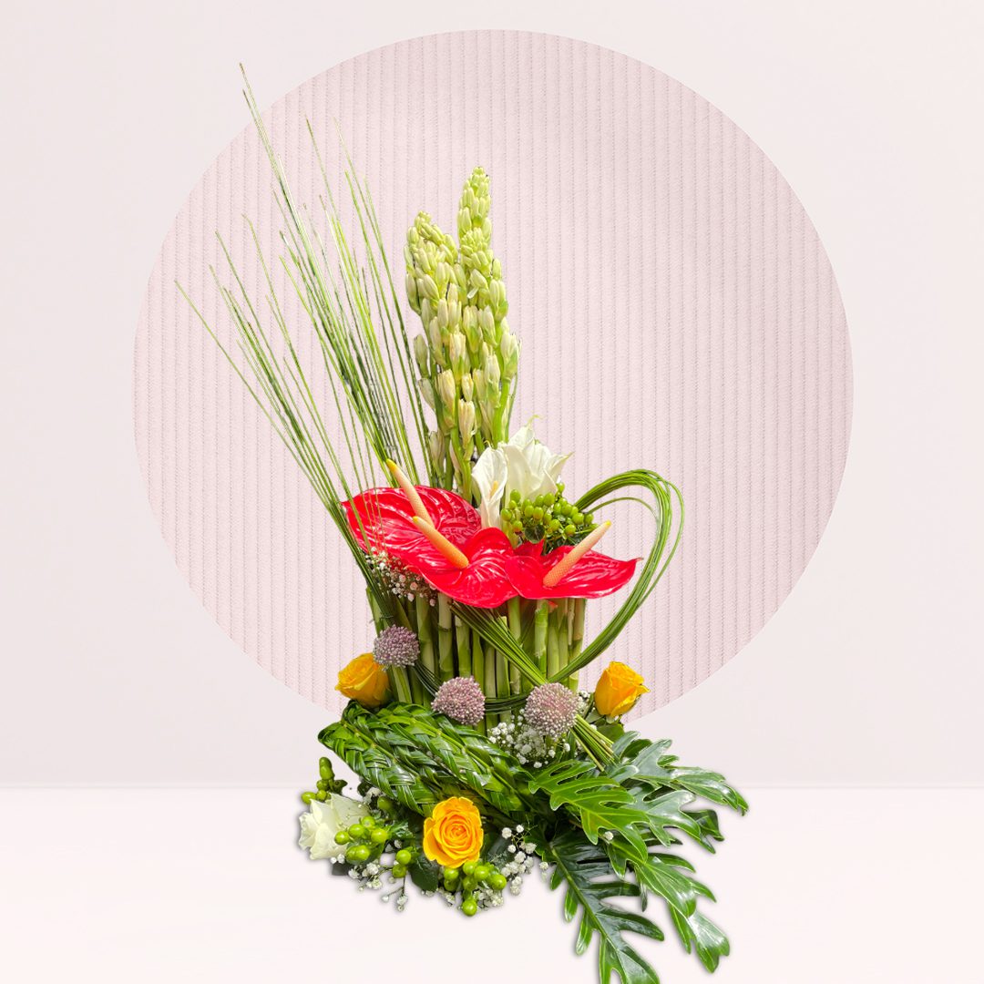 Red and white flower centrepiece with seasonal greenery.