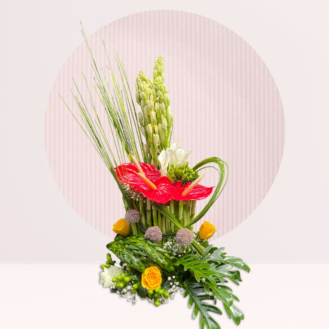 1 (232) Red and white flower centrepiece with seasonal greenery.