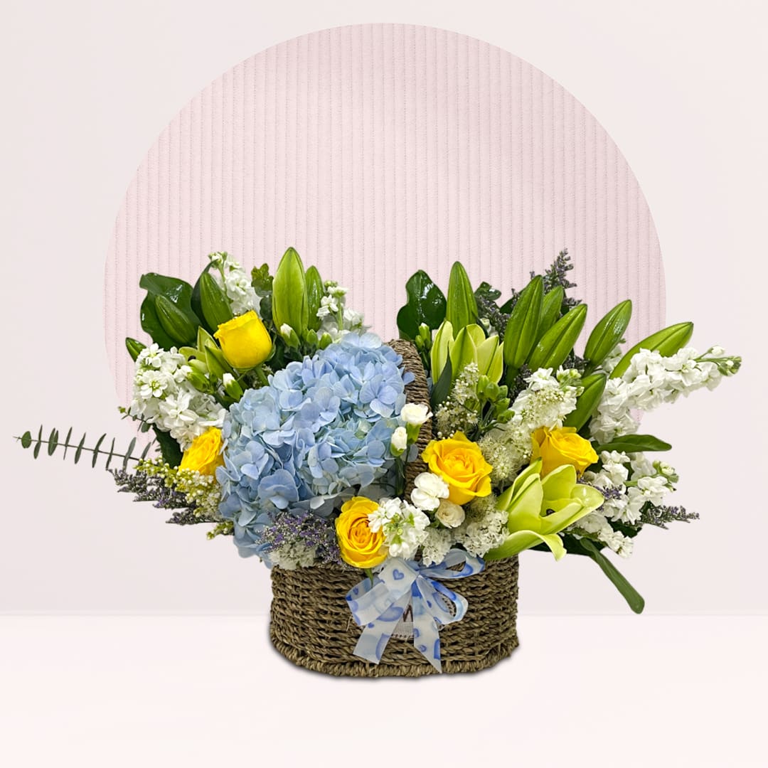 1 (243) Blue hydrangea lily basket with yellow roses, lilies, fillers and greenery.