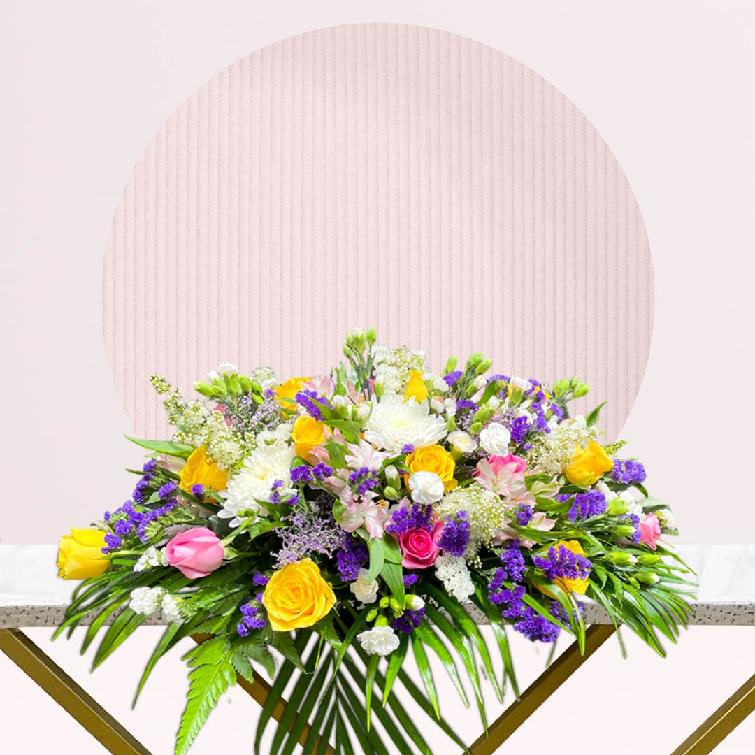 1 (250) Colourful mixed flower arrangement with fresh seasonal blooms.