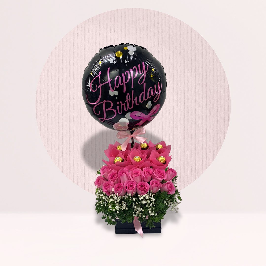 Celebrate joyfully with our Box of Pink Roses, Gypso, and Greenery, complemented by a cheerful birthday balloon.