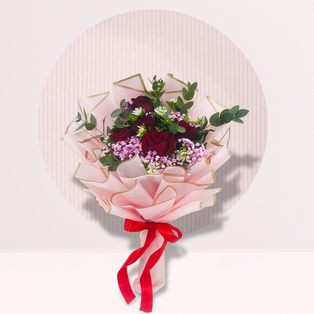 bouquet of flowers, wrapped in pink paper and tied with a red ribbon, against a light pink background with a white circle behind it. The bouquet contains red roses, white daisies, and sprigs of green leaves. The overall aesthetic is soft and romantic