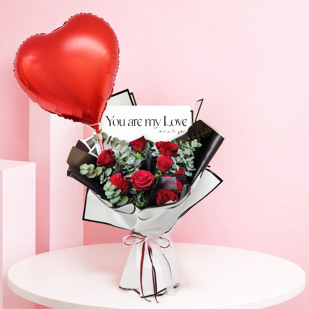 01 Red rose heart balloon bouquet with eucalyptus in white wrapping with black trim, finished with a red heart balloon and a “You Are My Love” wrap detail.