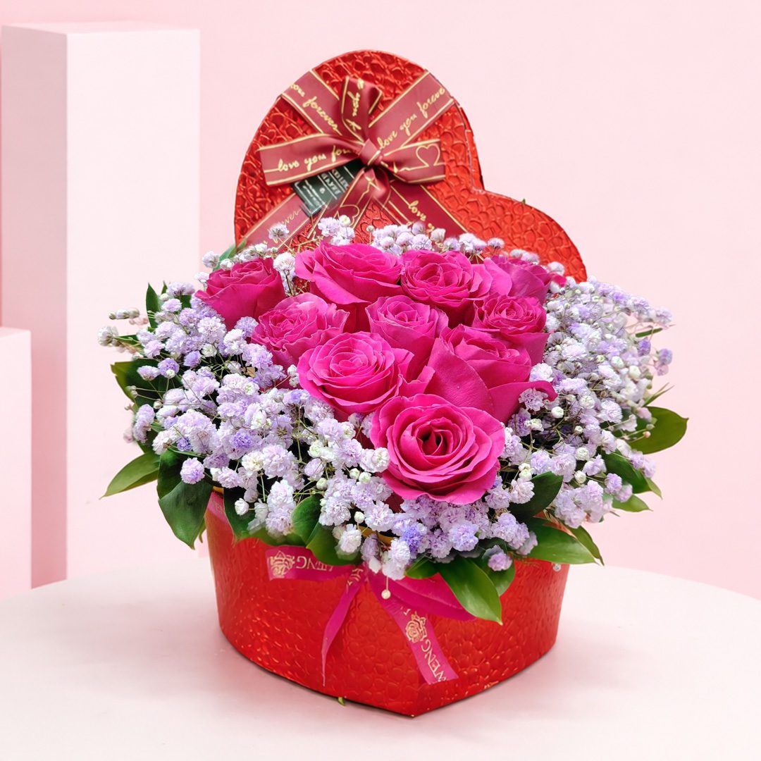 01 Valentine Pink Rose Box arrangement with hot pink roses and baby’s breath, finished with a “love you forever” ribbon.