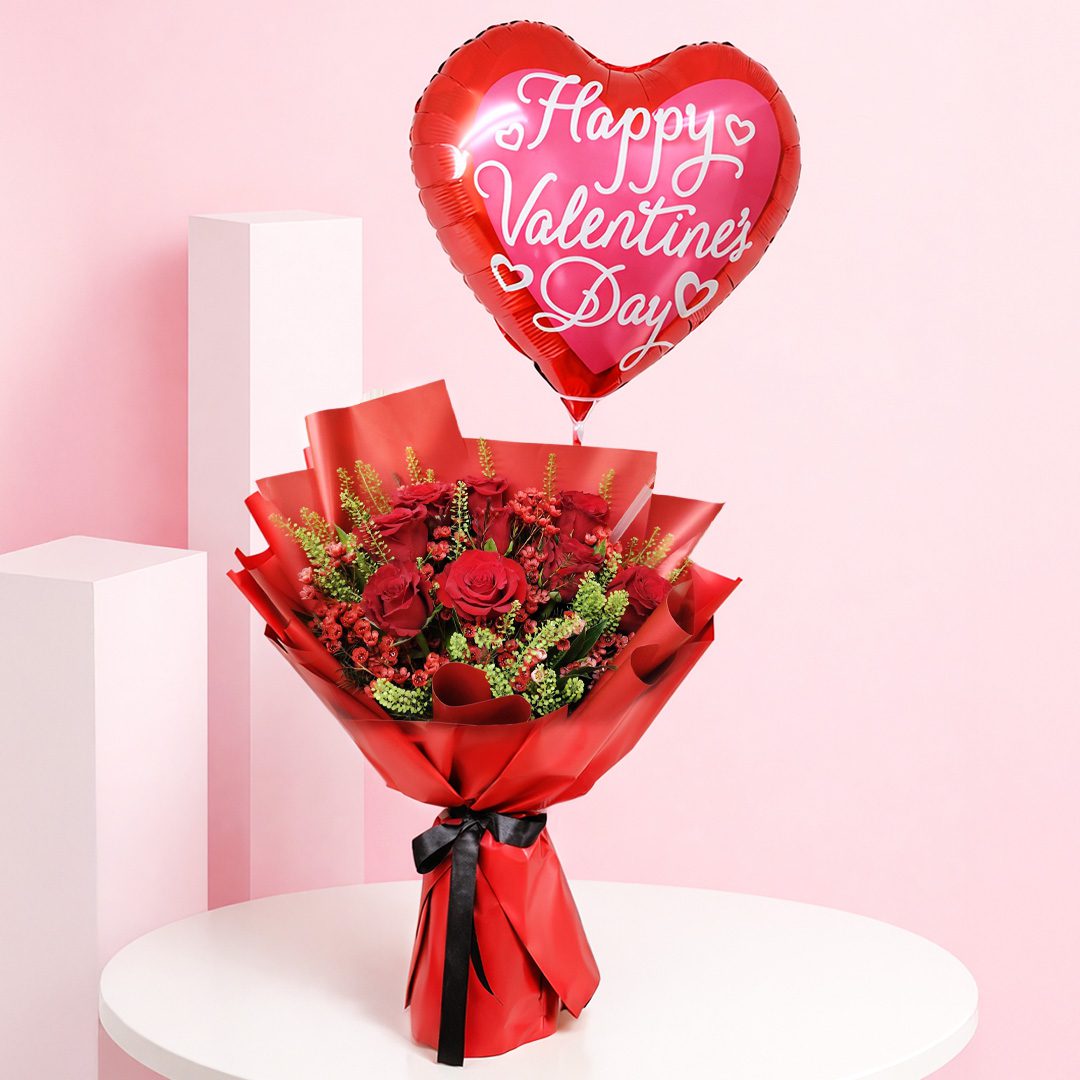 01 Red rose valentine balloon bouquet with seasonal fillers and greens in premium red wrapping, with a Happy Valentine’s Day heart balloon message