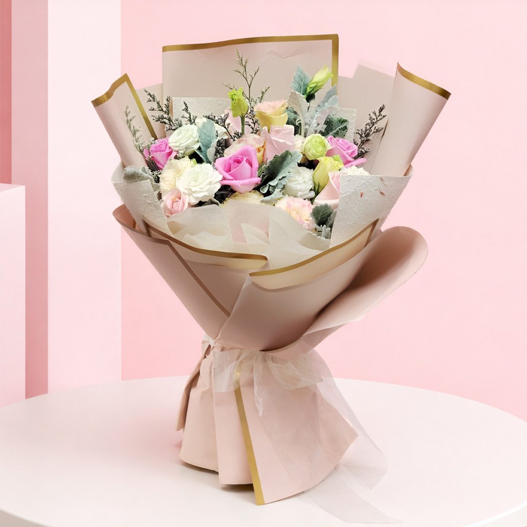 01 Pastel roses, seasonal blooms and greenery in premium cream wrapping with gold accents