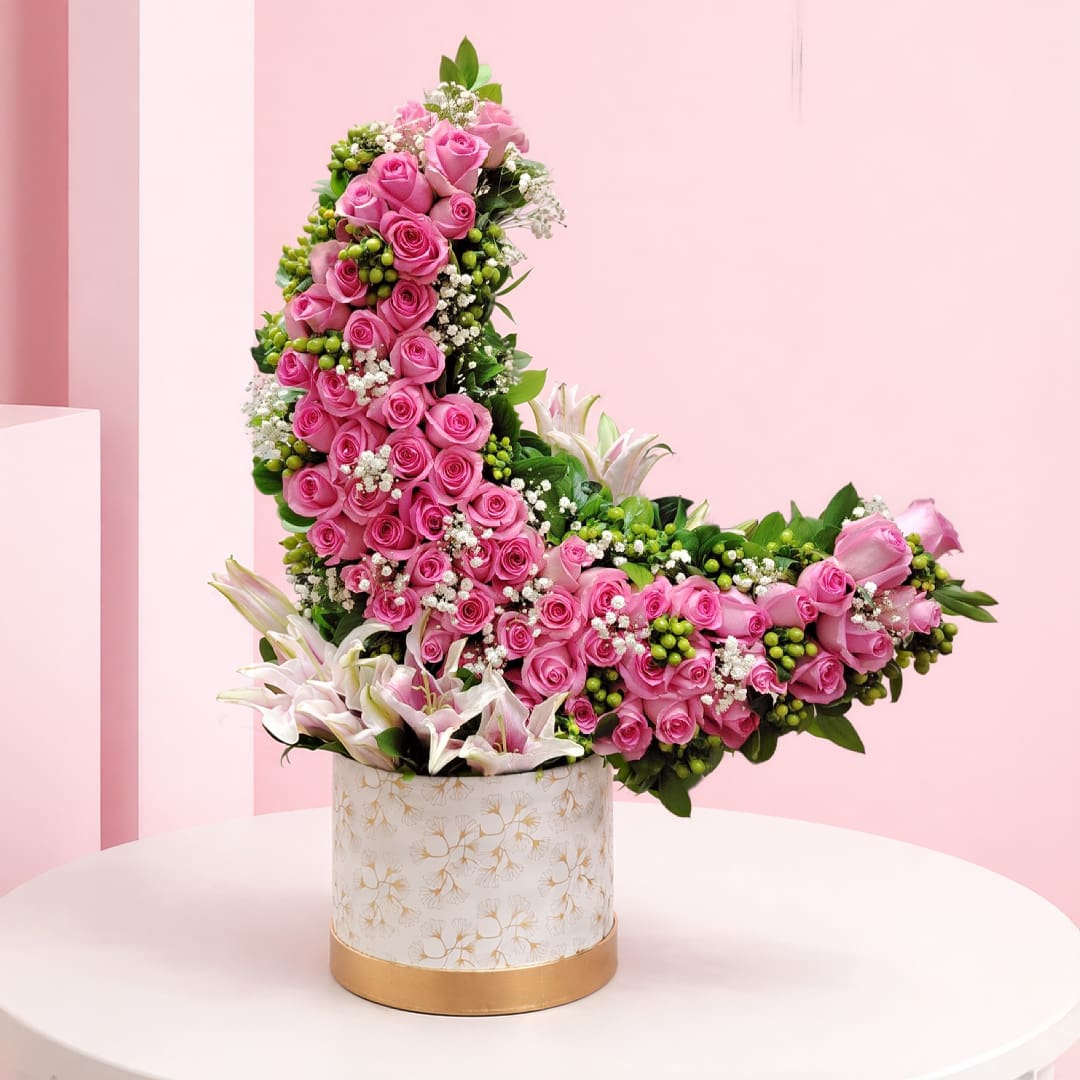 01 Pink rose and lily crescent flower arrangement with baby’s breath and greenery