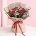 Rustic Charm Bouquet featuring roses, brunia, and eucalyptus arranged in a natural rustic bouquet for gifting